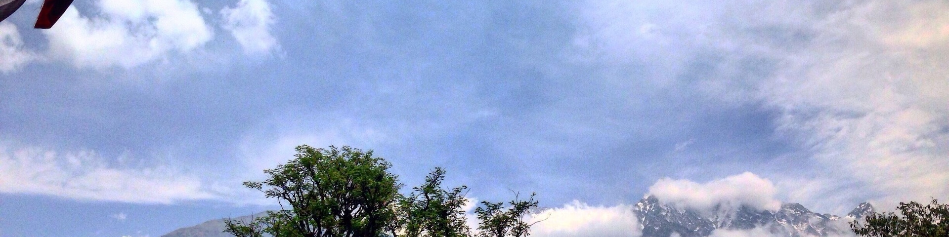 Buddhist prayer flags fluttering in the breeze overlooking snowy Himalayan range from the tea estates of Palampur.
Palampur is one of the hidden gems and is fast becoming a place for yoga and artsy endeavours in Himachal Pradesh.