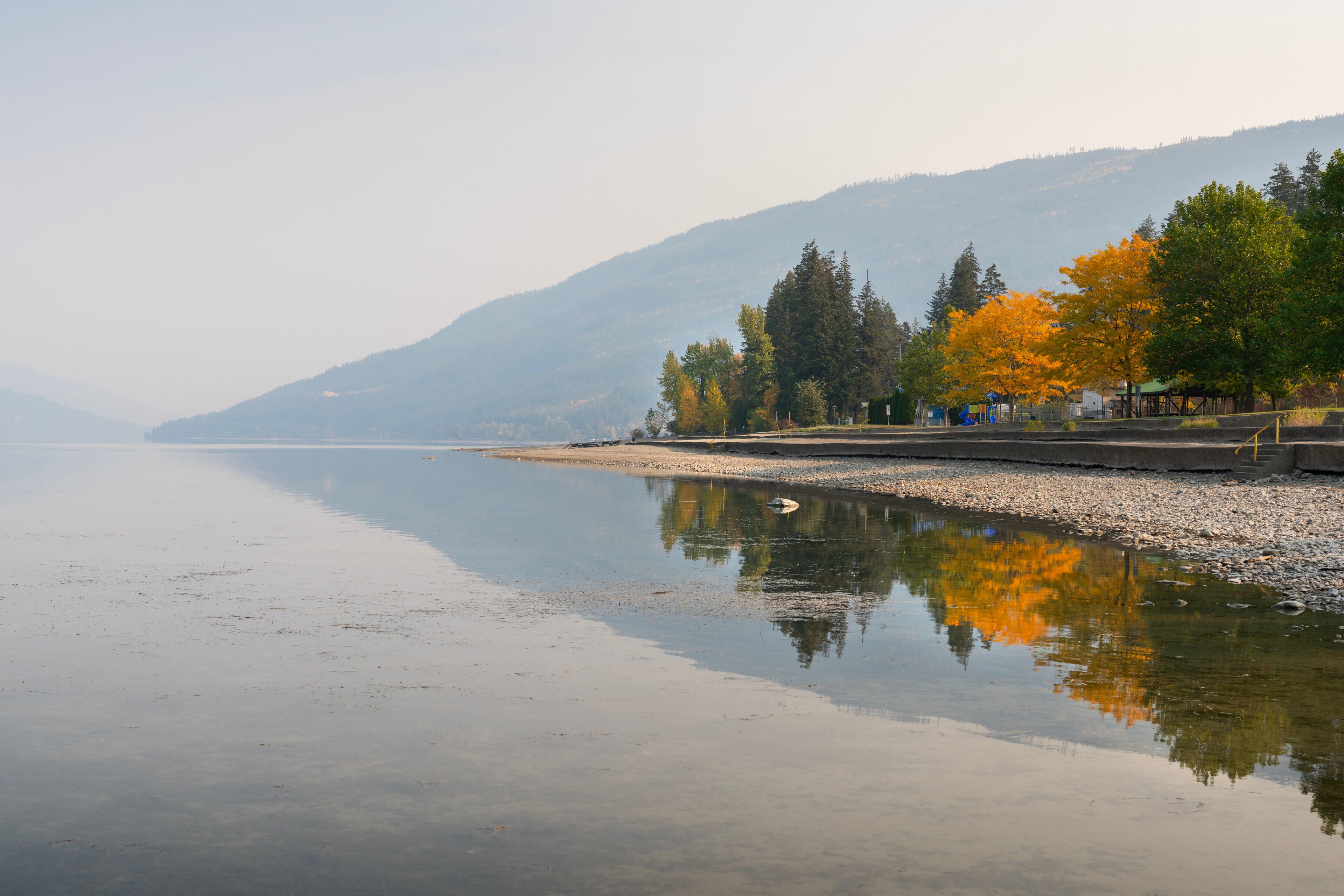 Shuswap Lake Canoe Beach Park Autumn Salmon Arm.Canoe Beach Park and playground on the shore of Shuswap Lake, British Columbia, in autumn. 
