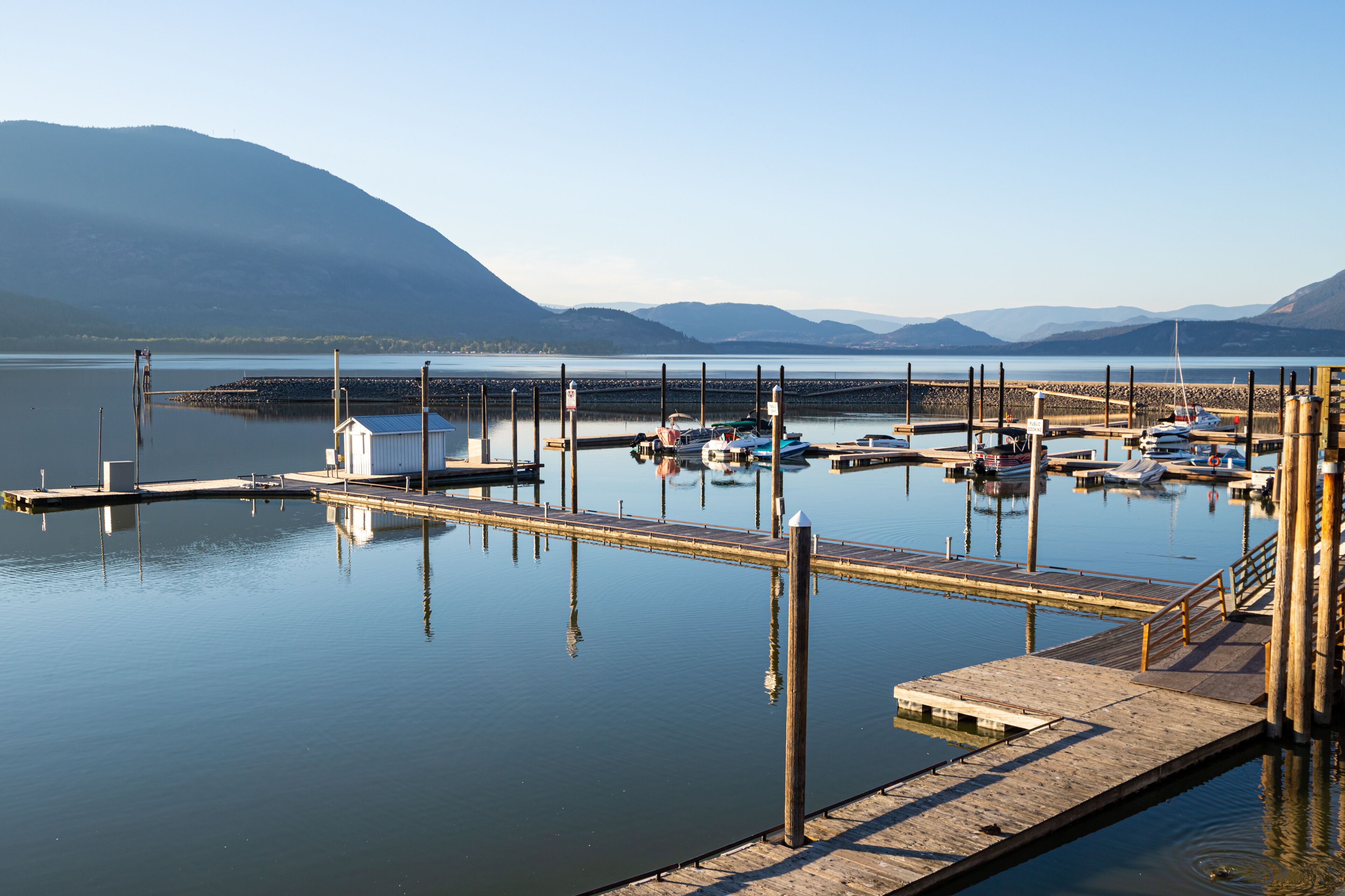 Shuswap Lake, Salmon Arm Wharf, Canada at sunset with boats