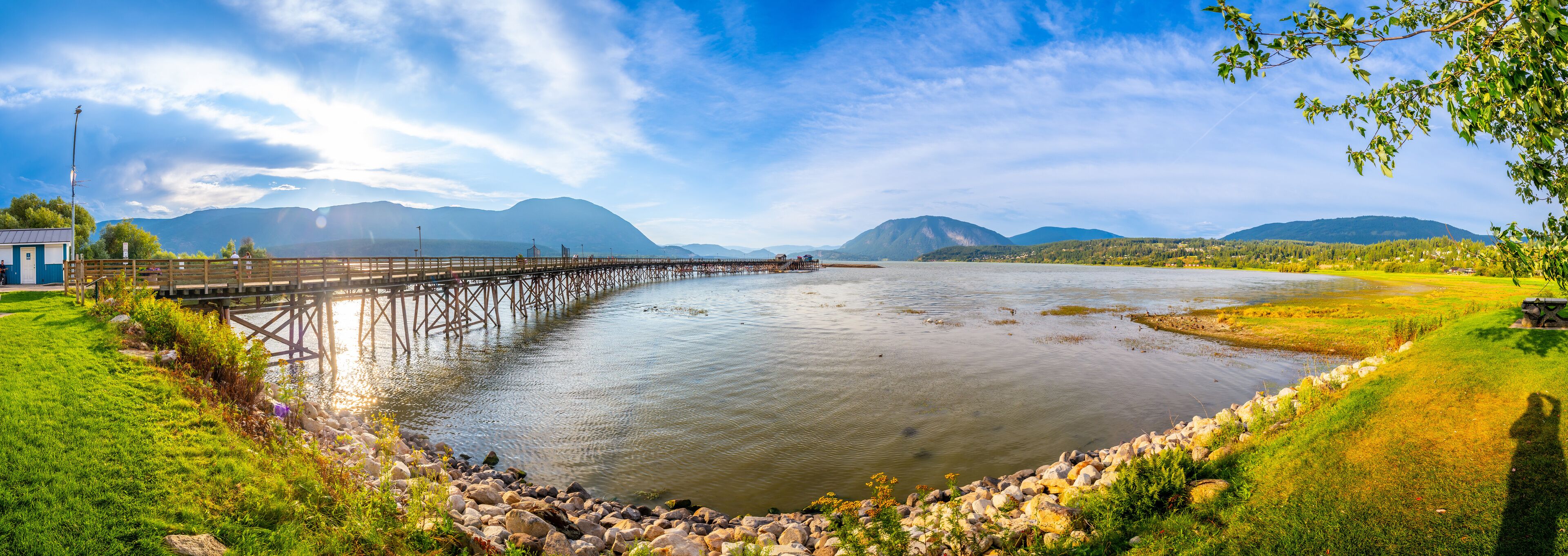 Long wooden pier stretching into shuswap lake in salmon arm, british columbia
