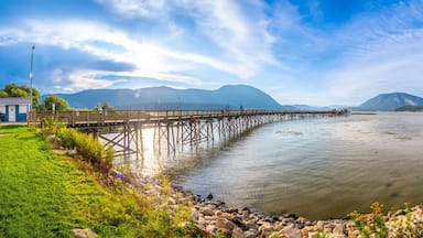 Long wooden pier stretching into shuswap lake in salmon arm, british columbia