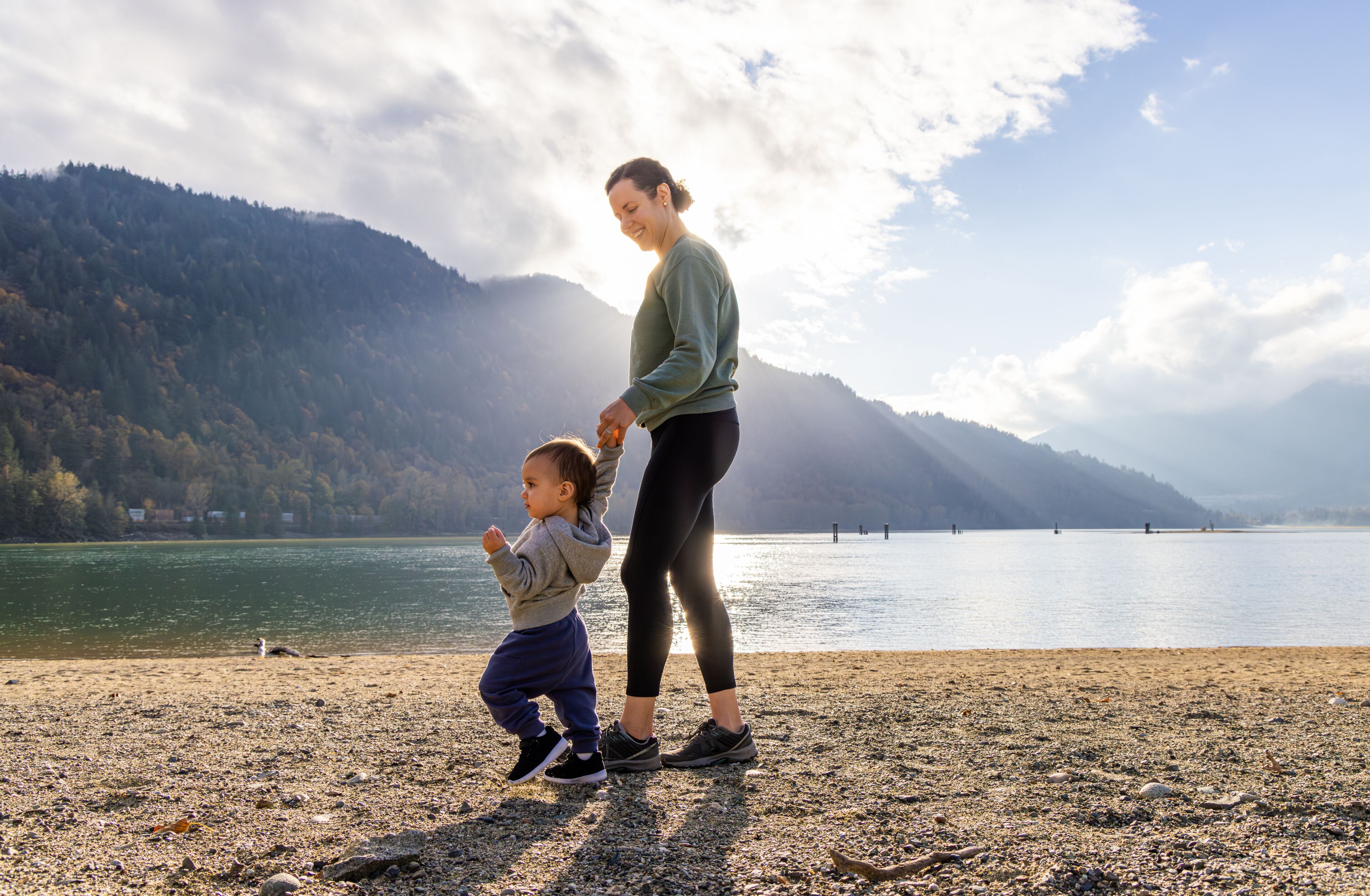 Mother and Child Enjoying a Walk by the Lake