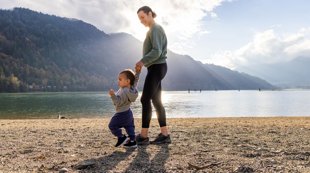 Mother and Child Enjoying a Walk by the Lake