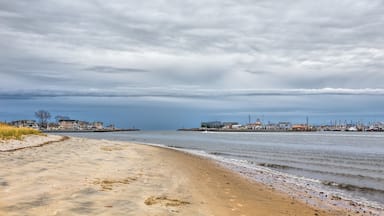 Manasquan Inlet at the New Jersey Shore separating the towns of Manasquan and Point Pleasant. It is a cloudy day.; Shutterstock ID 522674020