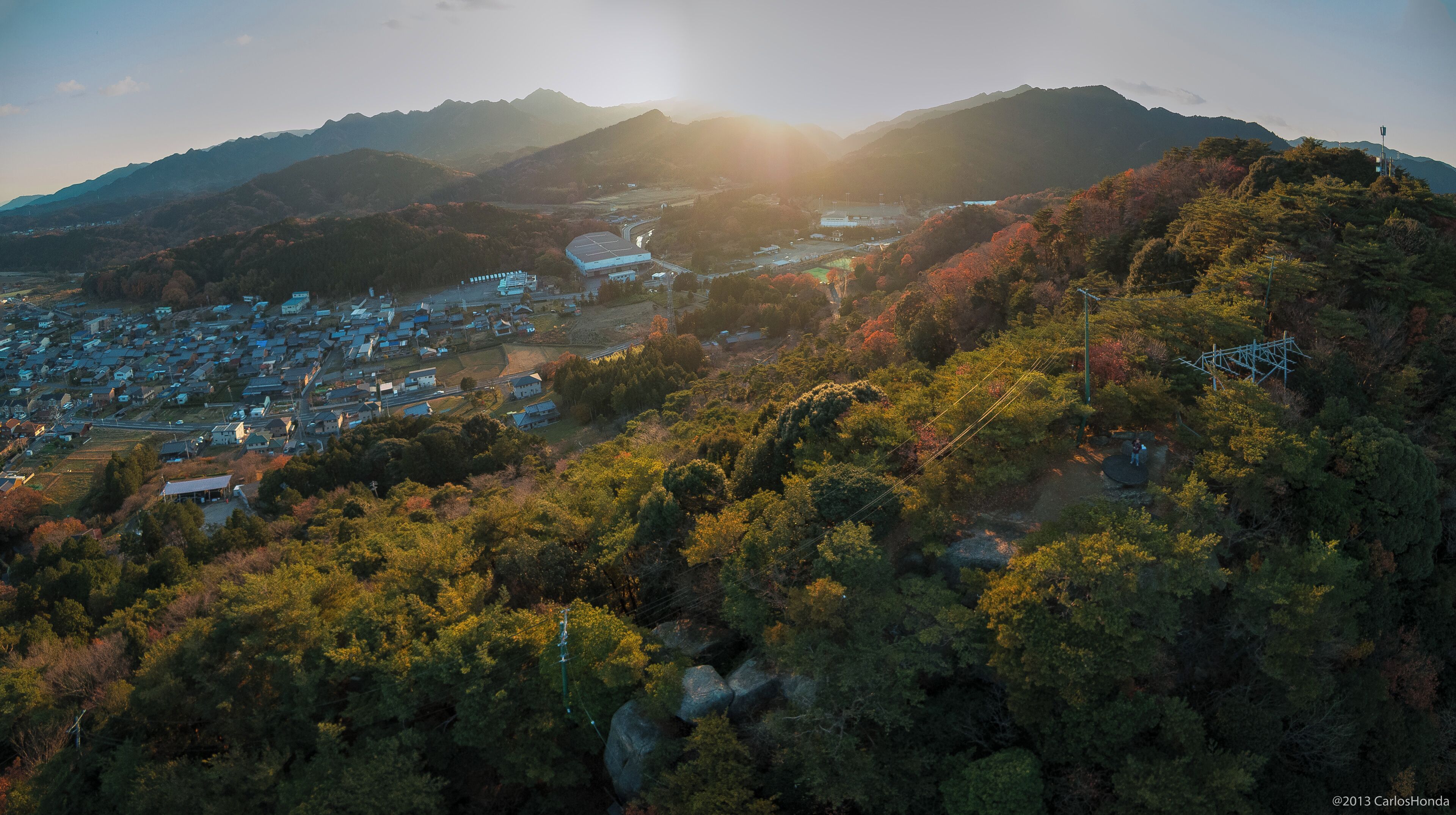 A mountainous landscape with a town nestled in the valley.