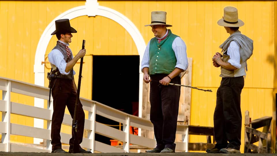 Playing their part in the living museum recreating colonial life in New England, participants of Old Sturbridge Village in Sturbridge, Mass play their roles dressed in period garb.