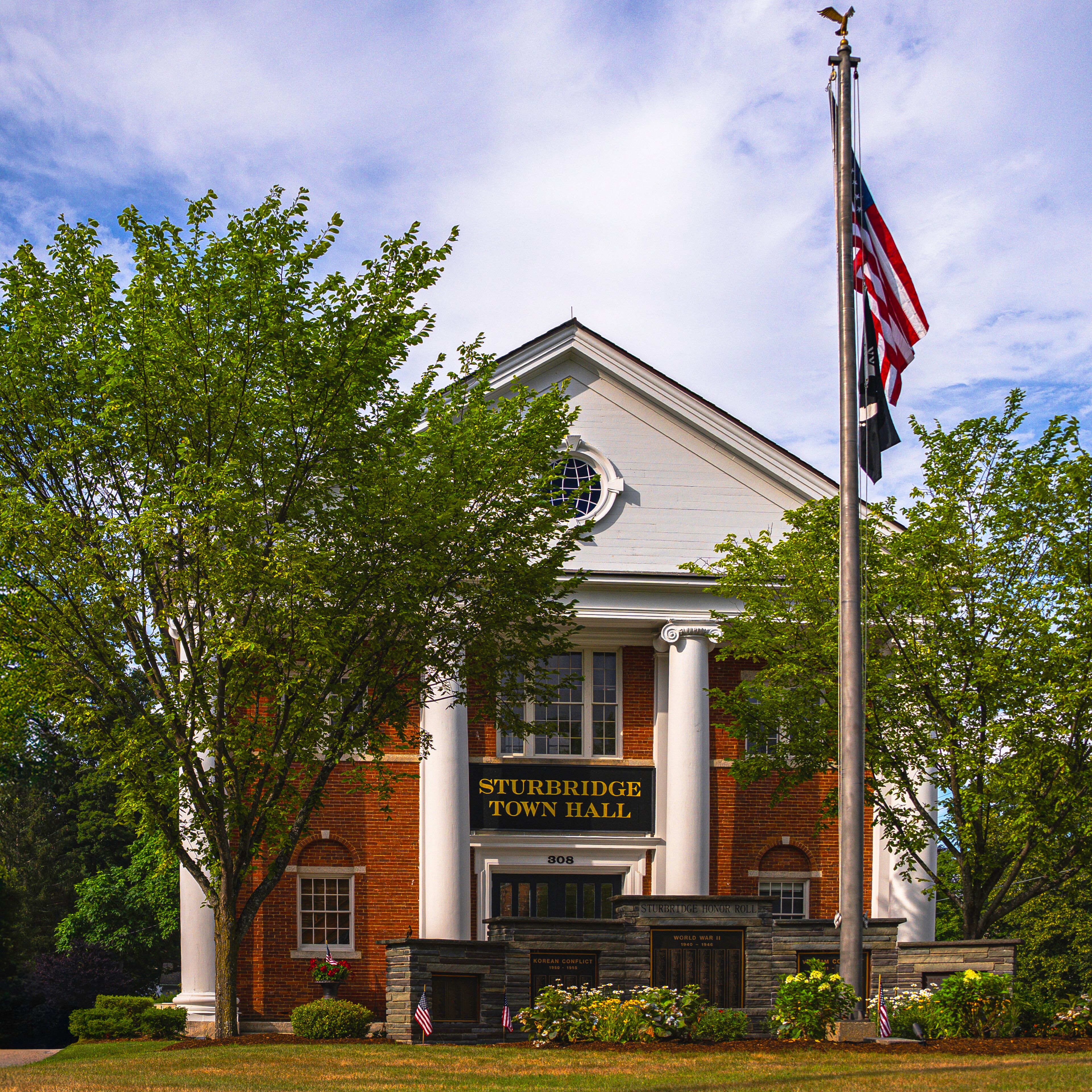Sturbridge Town Hall in Massachusetts, built in 1838, stands as a proud example of Greek Revival architecture with Colonial Revival enhancements