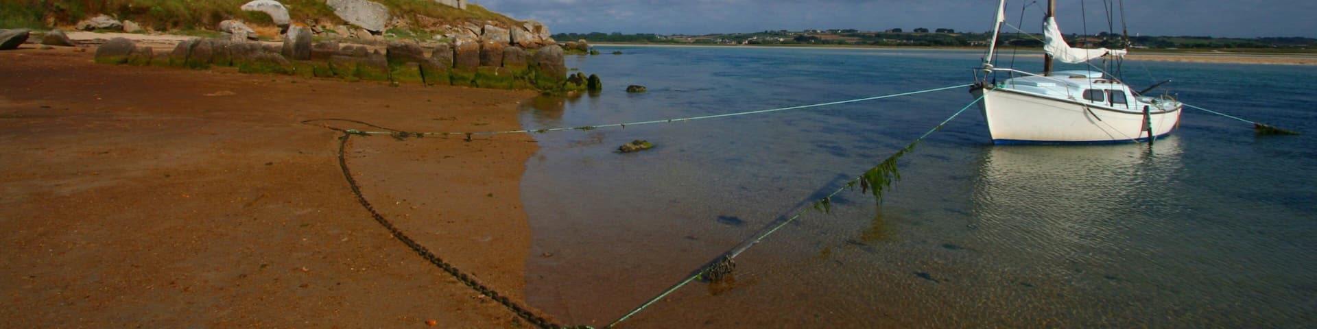 Plouescat showing general coastal views, boating and a sandy beach