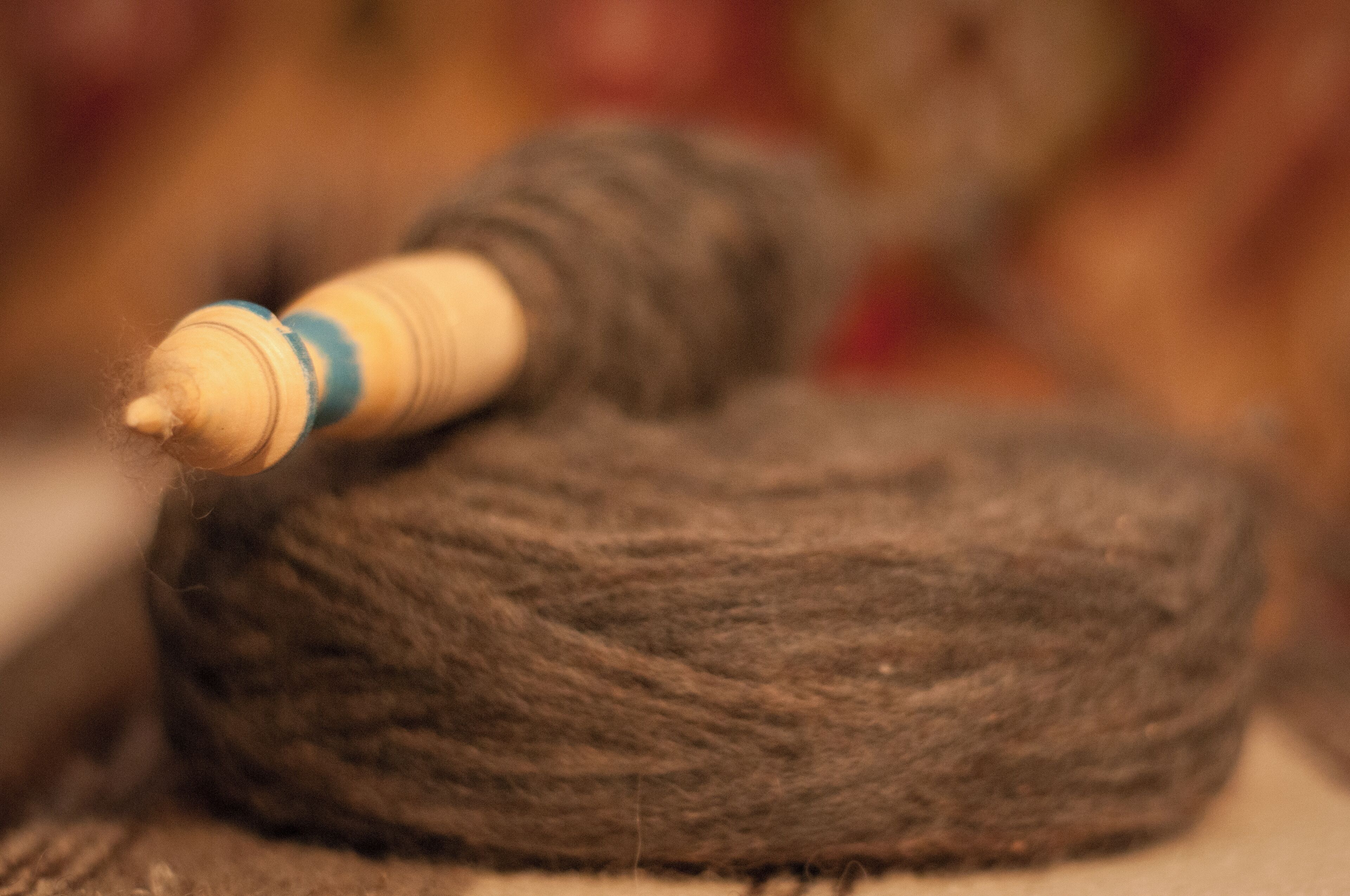 As you enter Moeciu de Sus, in the second house to your right, you will find Maria Dumitru - one of the last artisans of the area. 
She 'has a loom in her house from Moeciu de Sus. It is one of the few being still used in the Bran area. The young lady learned weaving from her mother and is happily still creating bags and carpets using traditional colours and designs. The main colours used in Romanian weaving are black and white, sometimes mixed with earthy colours (the only ones still obtained naturally for the wool). She also crochets – so I was happy to try out her loom and buy some beautiful winter accessories handmade by her. I always like to encourage local producers! It’s what keeps them alive. It’s what keeps a nation’s soul alive.'