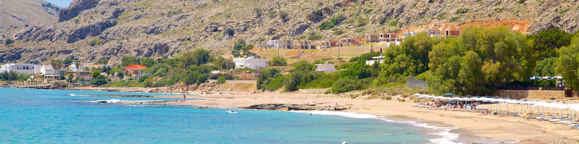 Pefkos Beach ofreciendo una playa, litoral accidentado y vistas de una costa