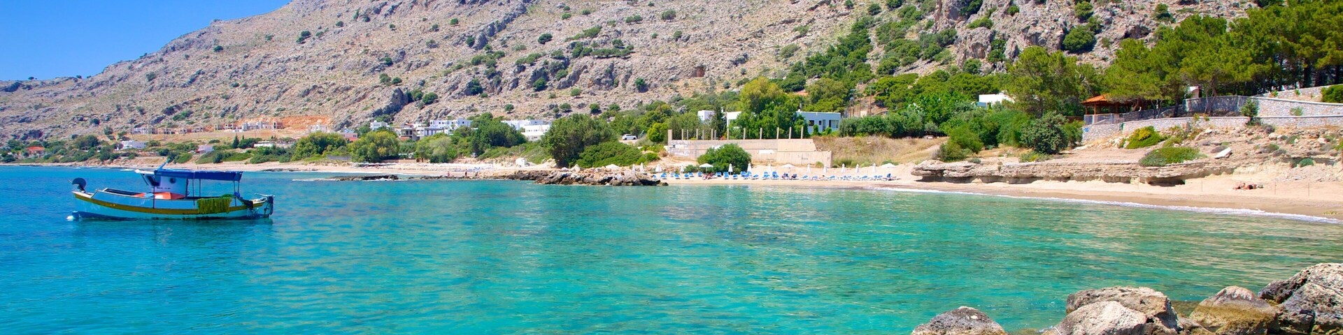 Pefkos Beach which includes rugged coastline and general coastal views
