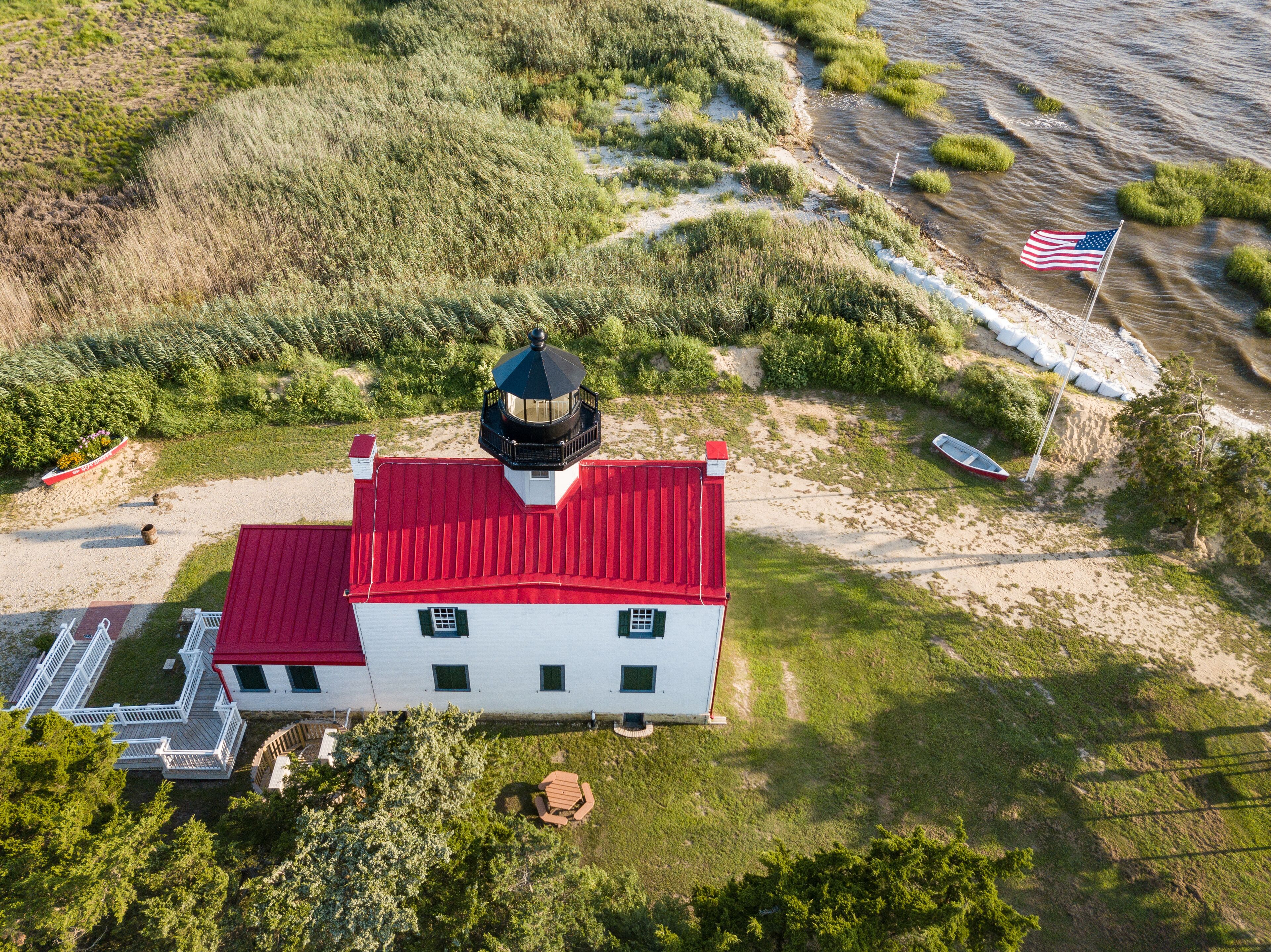 Aerial Drone image of the East Point Lighthouse on the Maurice River entrance to the Delaware Bay outside of Cape May