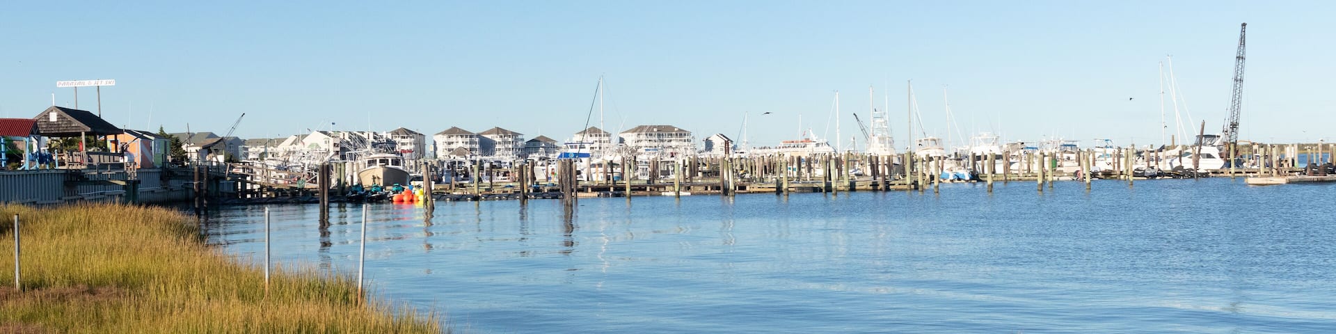 This is the shoreline of Cape May New Jersey right outside of the Lobster House in the parking lot. The water here seems so calm. I love the beautiful blue sky here and the pretty colors of the land.