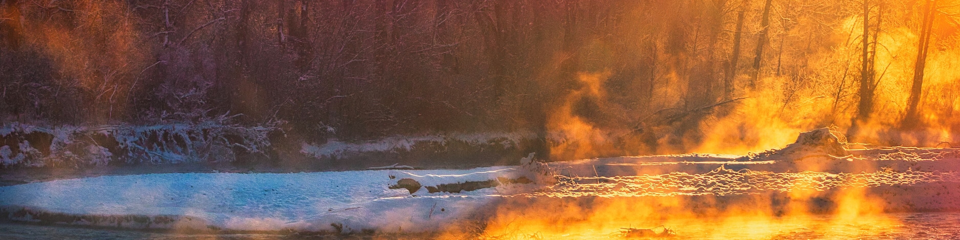 The Gallatin River feeds from Yellowstone National Park south of Bozeman, Montana and runs north to Headwaters State Park where it joins with the Madison and Jefferson to form the Missouri River. This shot was taken on a very cold, early November morning. Winter had landed but thermal vents in the river produce beautiful steam effects through the snow and ice.