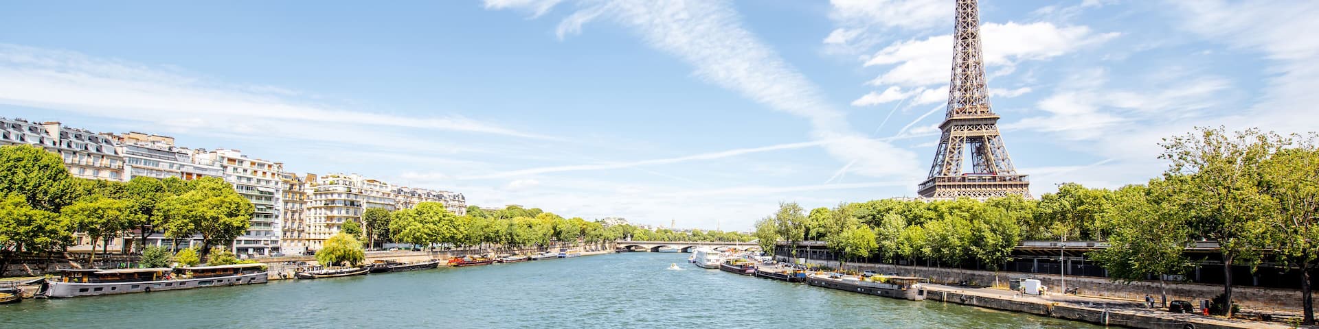 Landscape panoramic view on the Eiffel tower and Seine river during the sunny day in Paris
