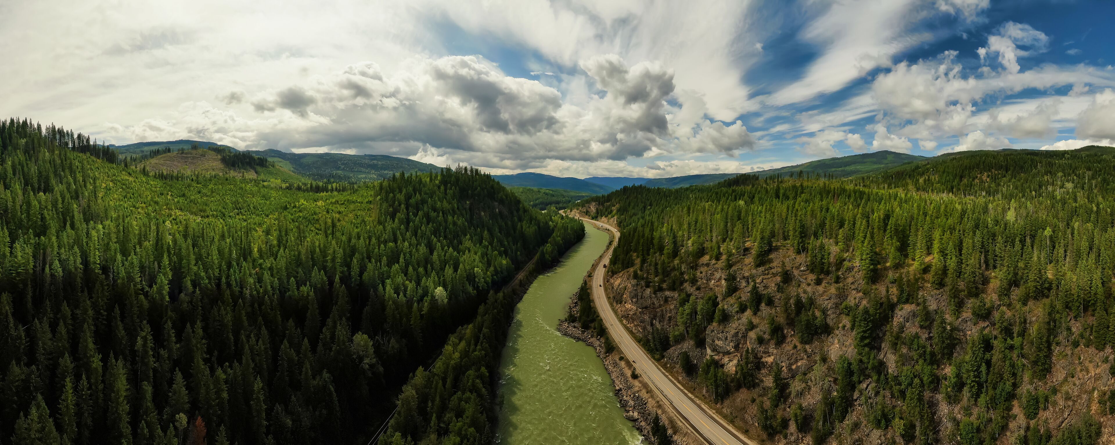 Aerial Panoramic View of a Scenic Highway in the Valley surrounded by Canadian Mountain Landscape. Taken near Clearwater, North of Kamloops, British Columbia, Canada.