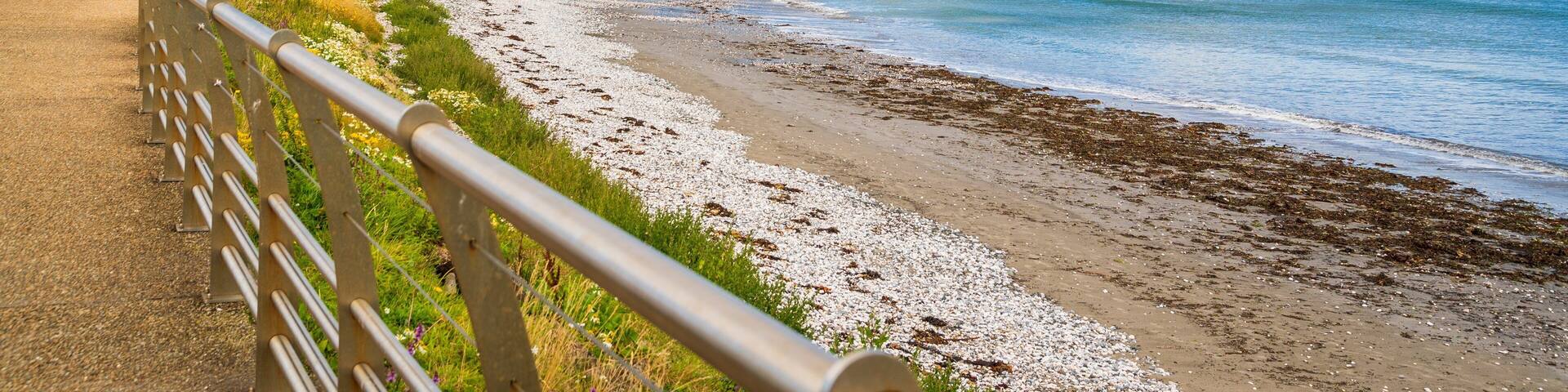 Glenarm featuring general coastal views, a beach and a coastal town