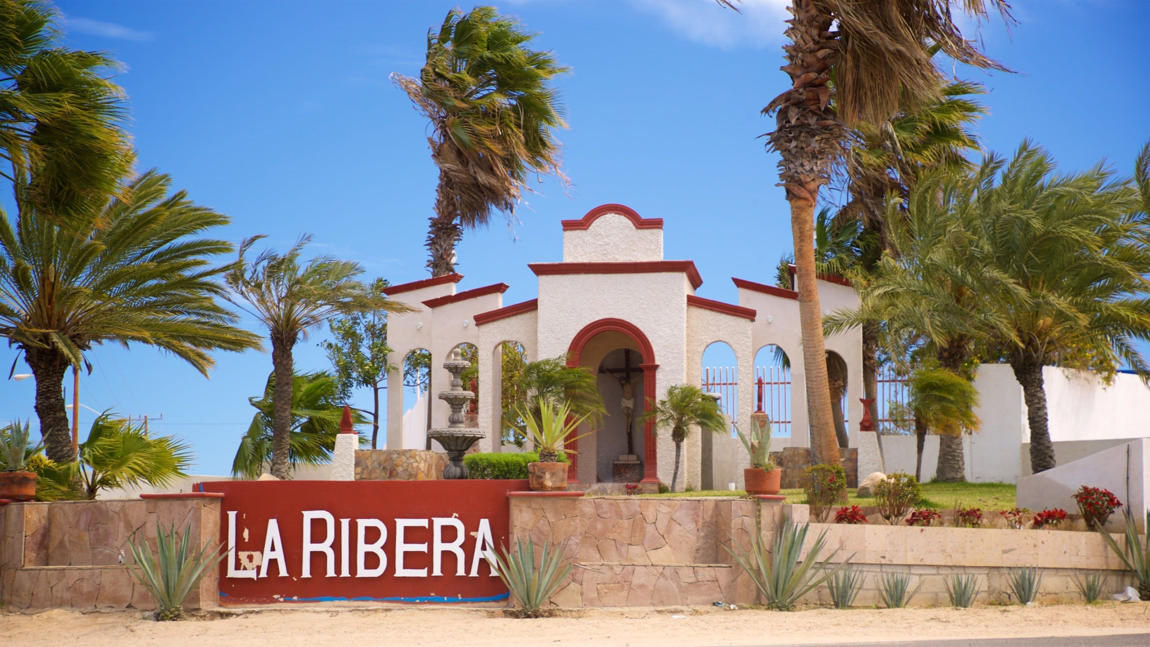 La Ribera featuring a church or cathedral and signage