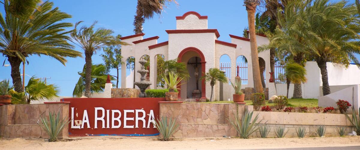 La Ribera featuring a church or cathedral and signage