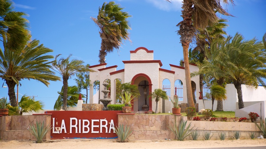 La Ribera featuring a church or cathedral and signage