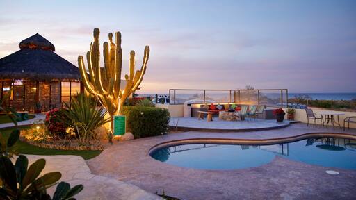 La Ribera which includes night scenes and a pool