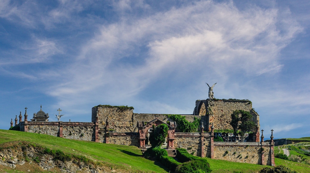 Angelic Statue Over Historic Cemetery in Comillas