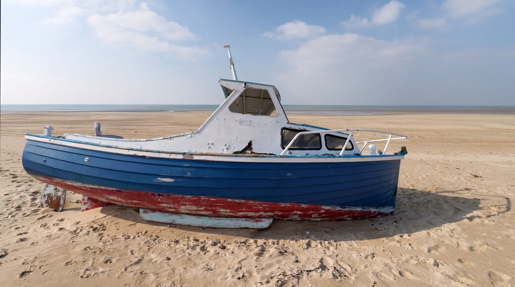 Low tide and old abandoned boat in the Cotentin coast. The havre of Saint-Germain-sur-Ay