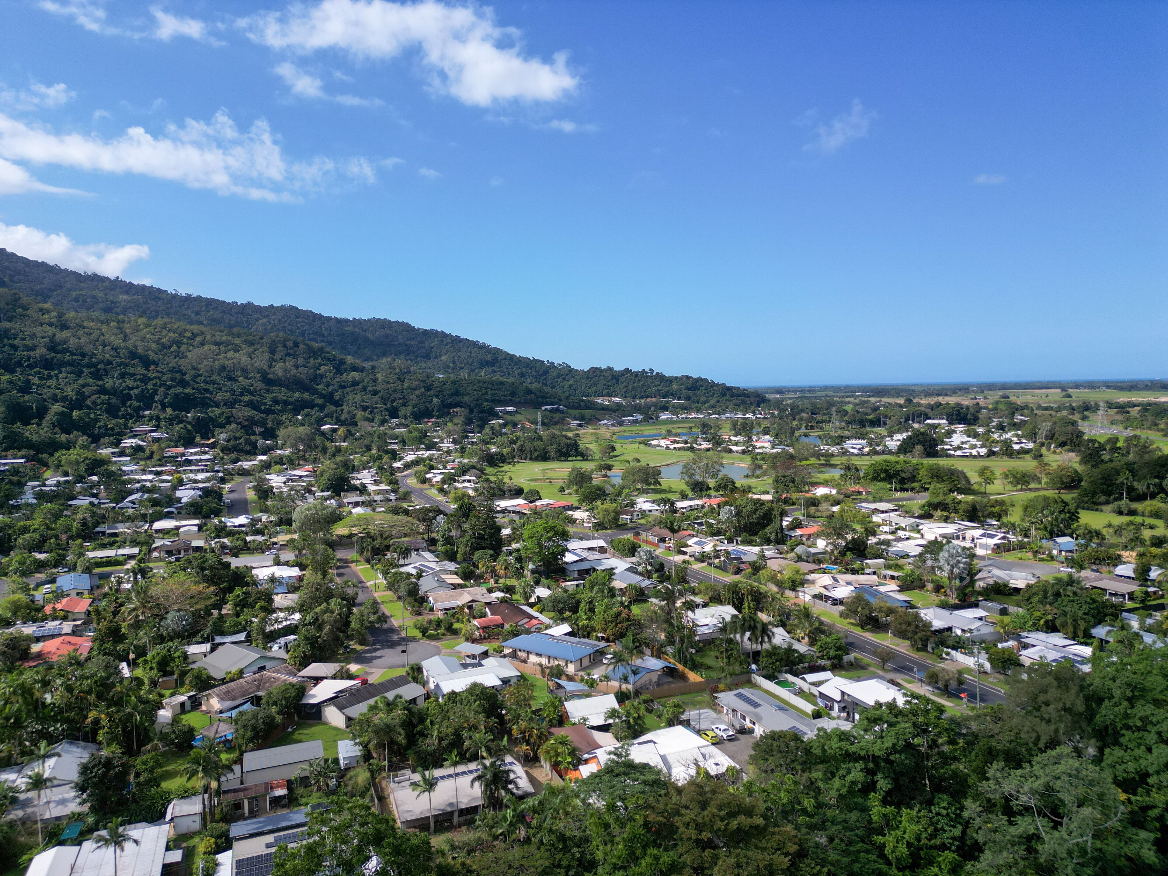 Aerial photo of tropical housing estate in mountain range