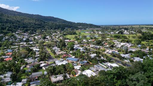 Aerial photo of tropical housing estate in mountain range