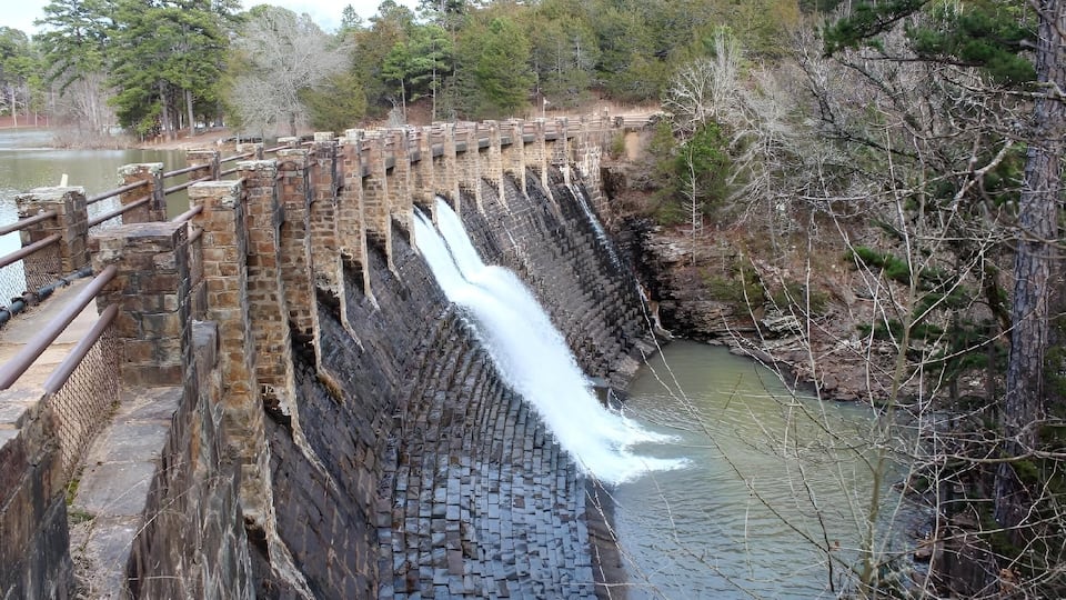 A large dam with multiple water channels.