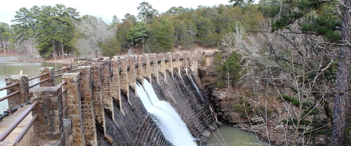 A large dam with multiple water channels.