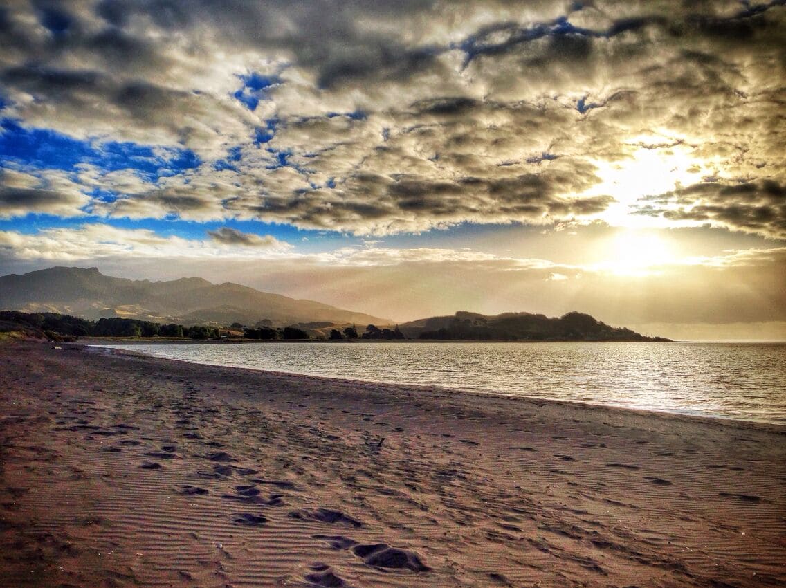 Raglan is a beautiful surf town in northern New Zealand - to save a few pennies just camp on the beach and be sure to take a surfing lesson