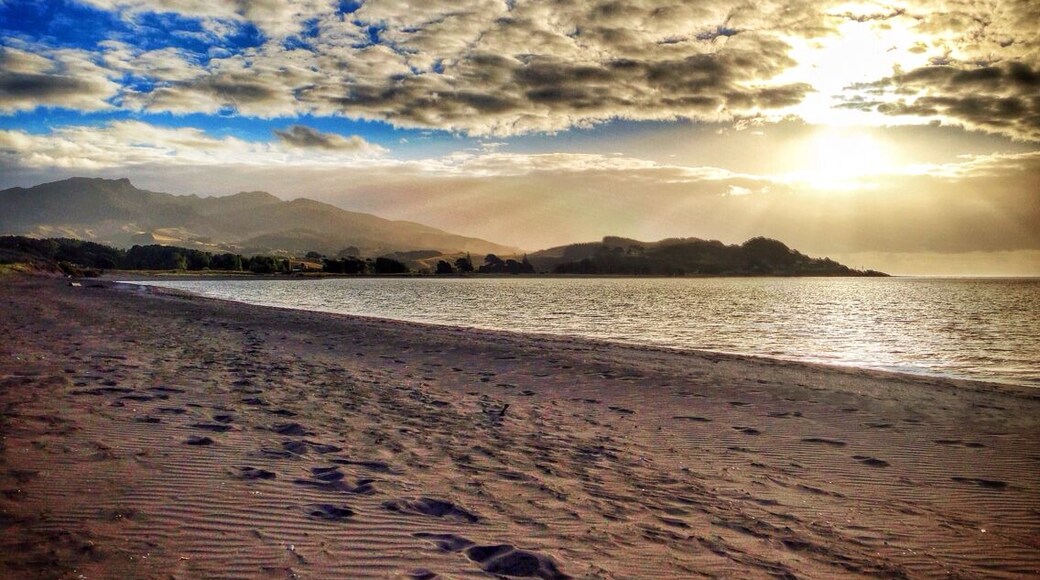 Raglan is a beautiful surf town in northern New Zealand - to save a few pennies just camp on the beach and be sure to take a surfing lesson