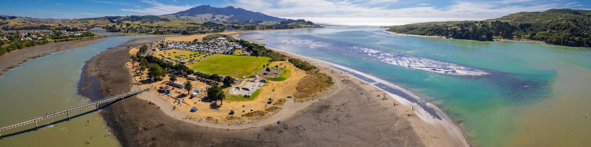 Aerial drone panoramic view over the seaside town of Raglan, on the West Coast of the Waikato region in the North Island of New Zealand.