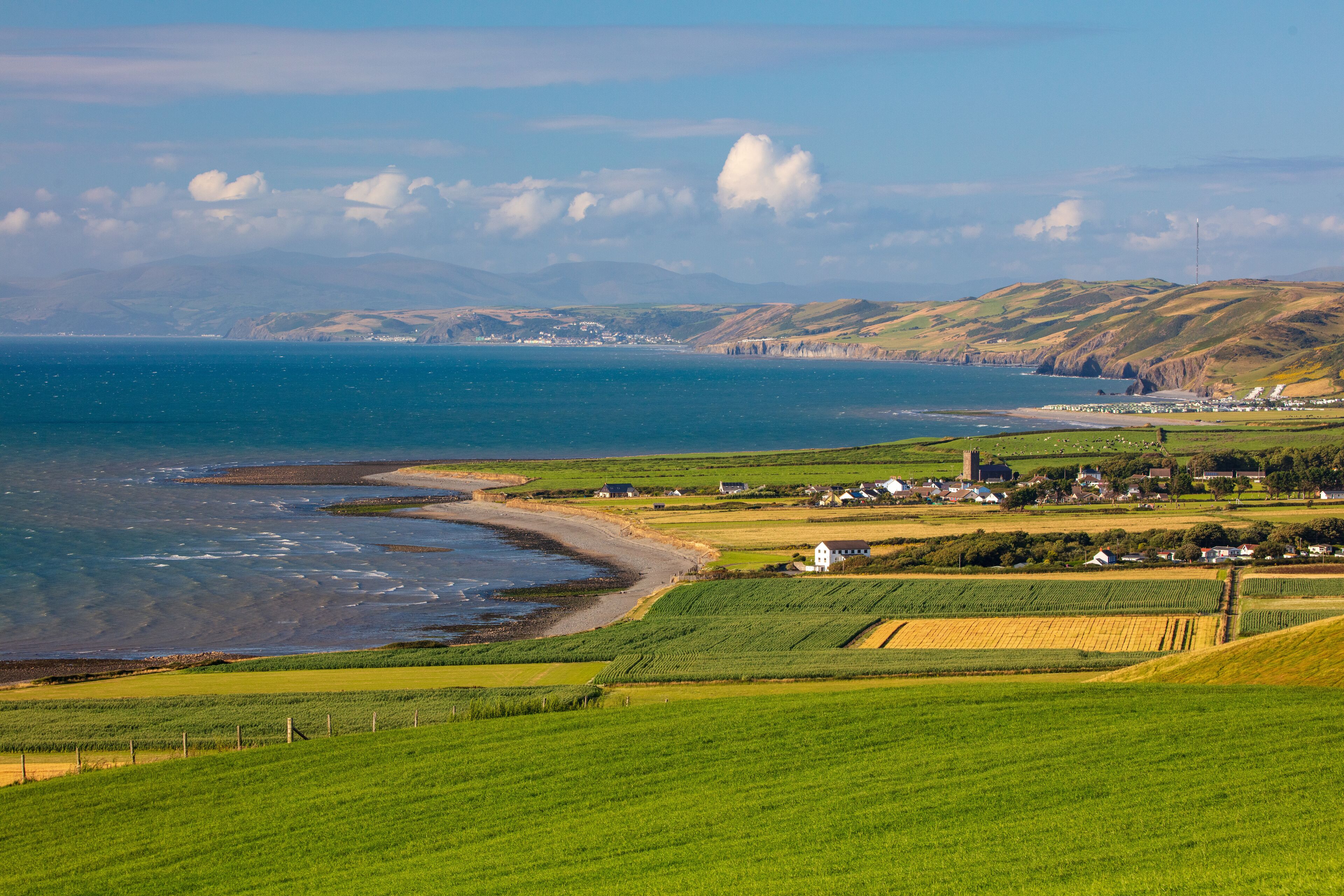 Elevated veiw of Cardigan bay with the small town of  llanon in the forground. West Wales, UK.