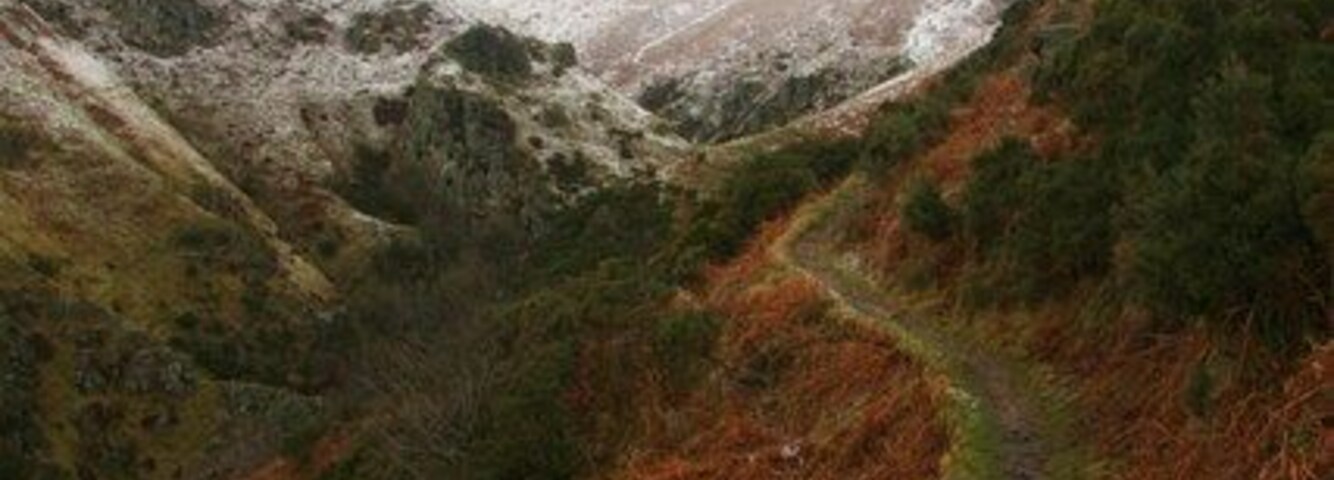 Footpath above Mill Glen The snow covered mass of the law in the centre.