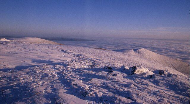 On Ben Cleuch. Southeast of the summit, looking down to The Law and a cloud inversion over the Forth.