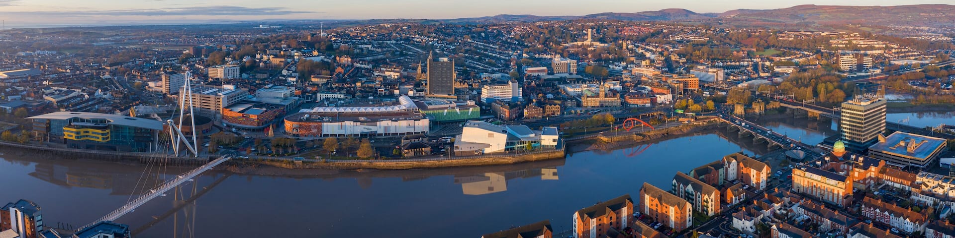 An aerial view at sunrise of Newport city centre, south wales United Kingdom, taken from the River Usk