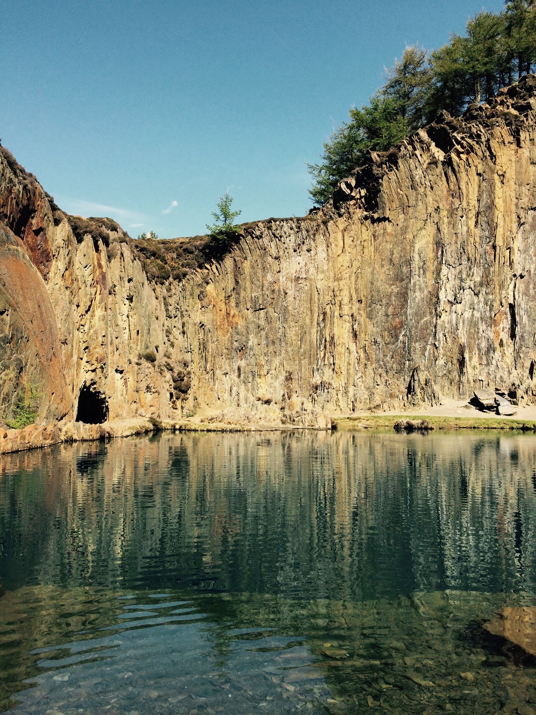 Disused quarry near Fairbourne. The lake is a sheer drop