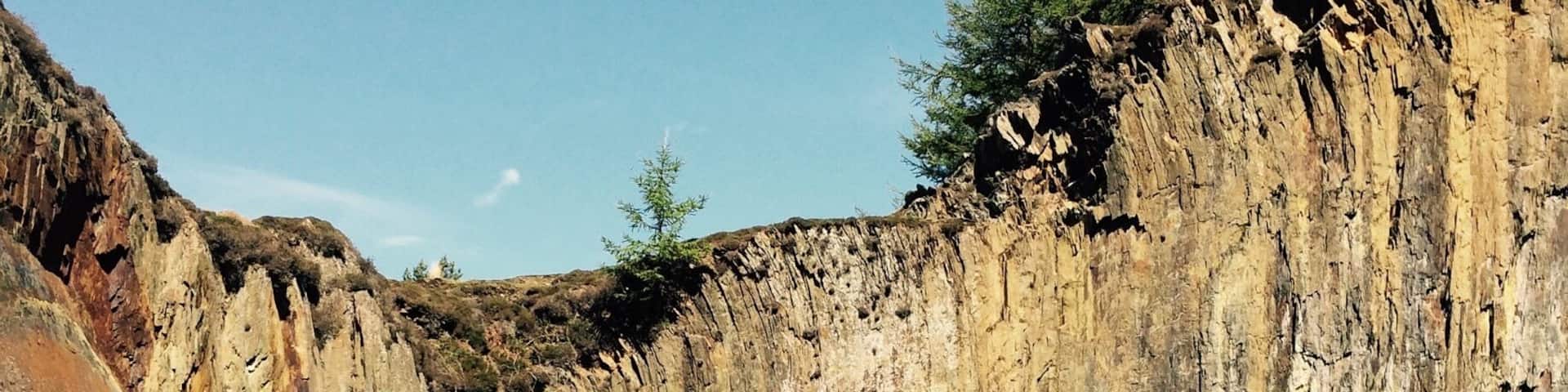 Disused quarry near Fairbourne. The lake is a sheer drop