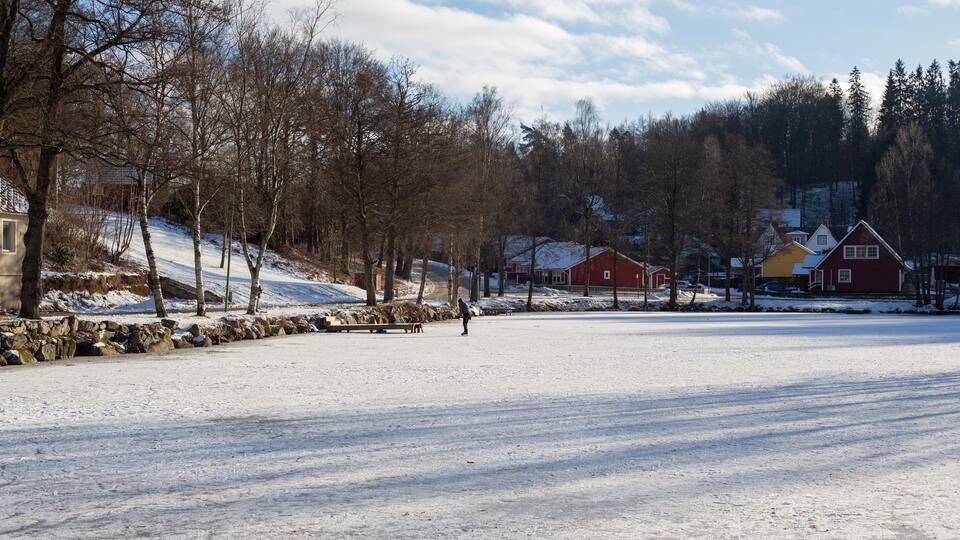Man skateing on the pond in Tyringe, Sweden