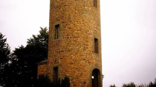 Rapunzel tower of Masseret. Cute village with the tower in the centre and a big hotel next door.