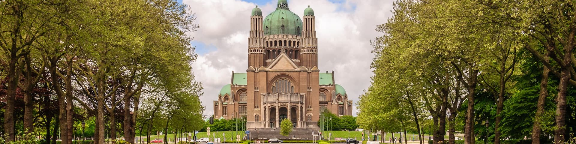 Perspective panoramic view from the Park Elisabeth to the National Basilica of Sacred Heart - Roman Catholic Minor Basilica (Basilique Nationale du Sacre-Coeur - Koekelberg) in Brussels, Belgium ; Sh