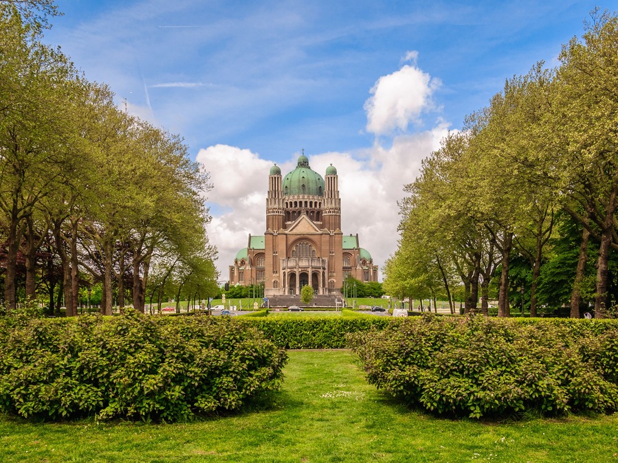 Perspective panoramic view from the Park Elisabeth to the National Basilica of Sacred Heart - Roman Catholic Minor Basilica (Basilique Nationale du Sacre-Coeur - Koekelberg) in Brussels, Belgium ; Sh