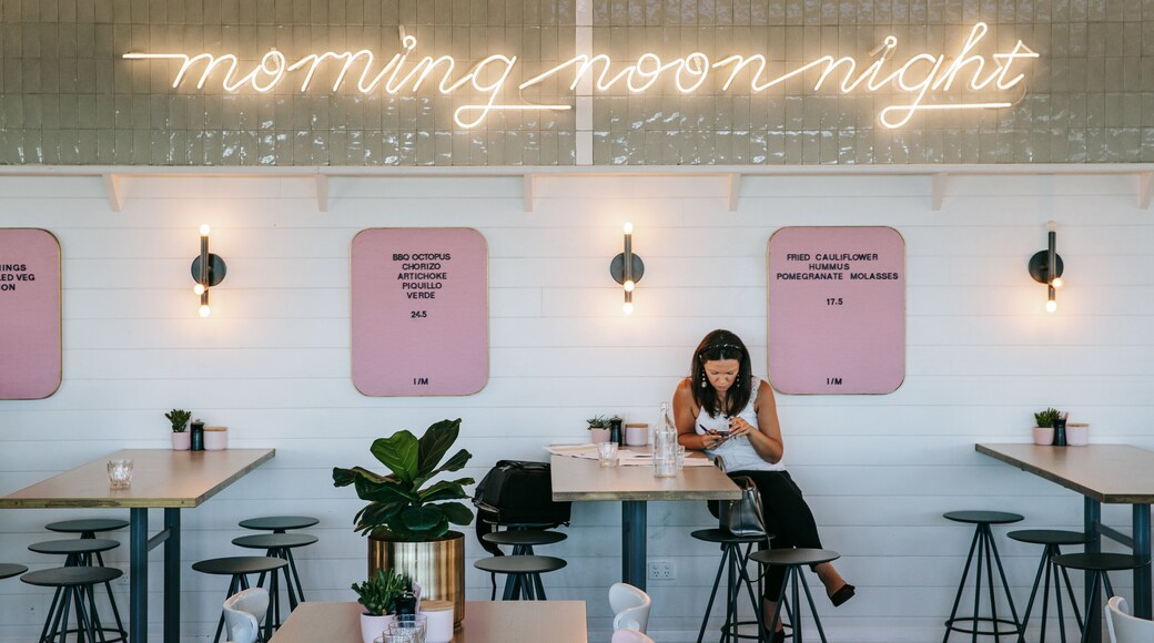 Trigg which includes cafe lifestyle and interior views as well as an individual femail