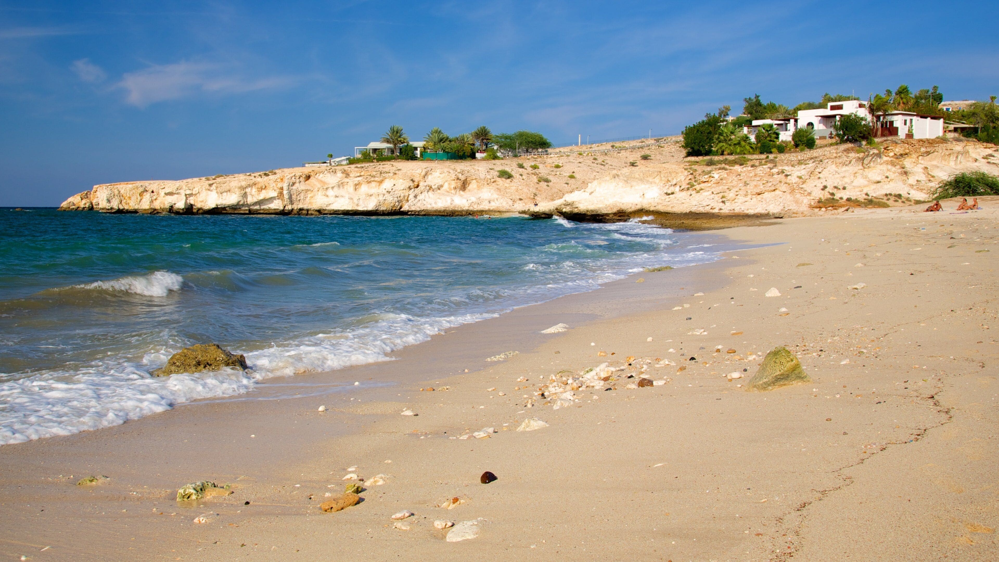 Shatti Al Qurum which includes general coastal views, rocky coastline and a sandy beach