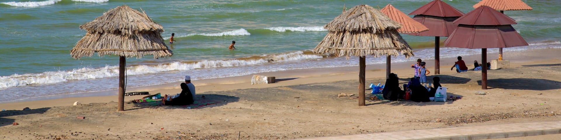 Shatti Al Qurum featuring general coastal views, a coastal town and rocky coastline