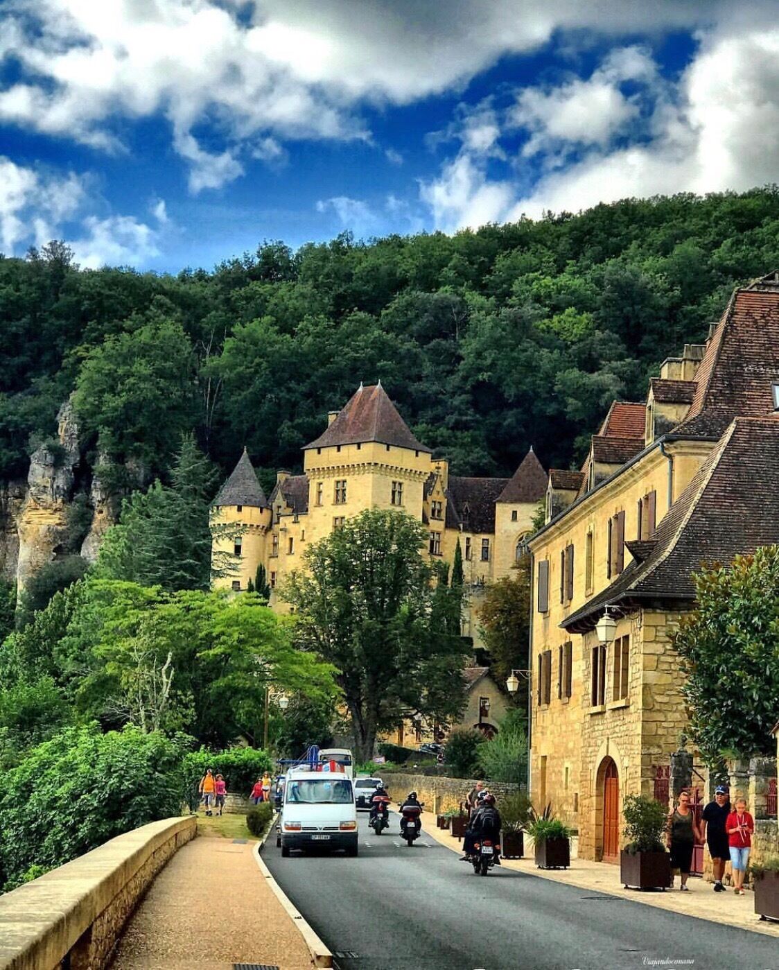 La Roque Gageac is one of France's most beautiful villages. In a stunning position on the north bank of the Dordogne River, and backed by a steep hill / cliffs, with little to suggest that much has changed there in the last 300 years, La Roque-Gageac is truly the perfect picture postcard village. It is about 8km from the historic town of Sarlat.

Explore La Roque-Gageac

The golden yellow houses with their traditional perigord rooves, line the river and spread up the hill behind. While some of the properties in La Roque Gageac are quite modest, there is also an impressive number of grand houses among them. One of the grandest of these is near the road as you enter from Beynac - the 19th century (although it appears older) Chateau de la Malartrie built in Renaissance style.