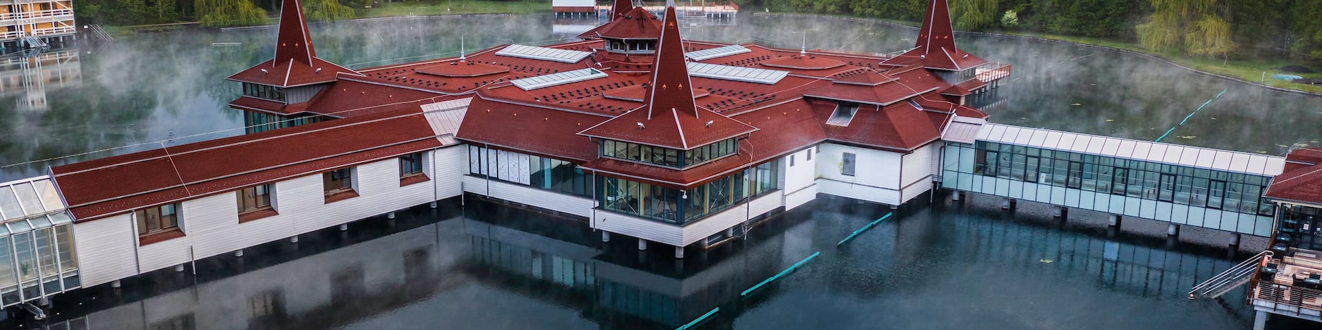 Heviz, Hungary - Aerial view of Lake Heviz at sunrise, the world’s second-largest thermal lake and holiday spa destination at Zala county on a summer morning with green trees