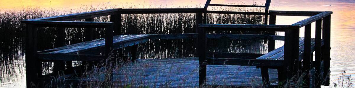 A bird viewing platform at sunrise over Jessie Lake